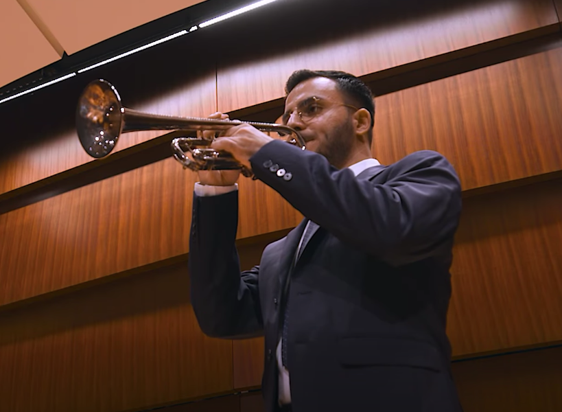 ‘A deeply personal weight’: Afghan KU alumnus sounds Taps for slain National Guard soldier